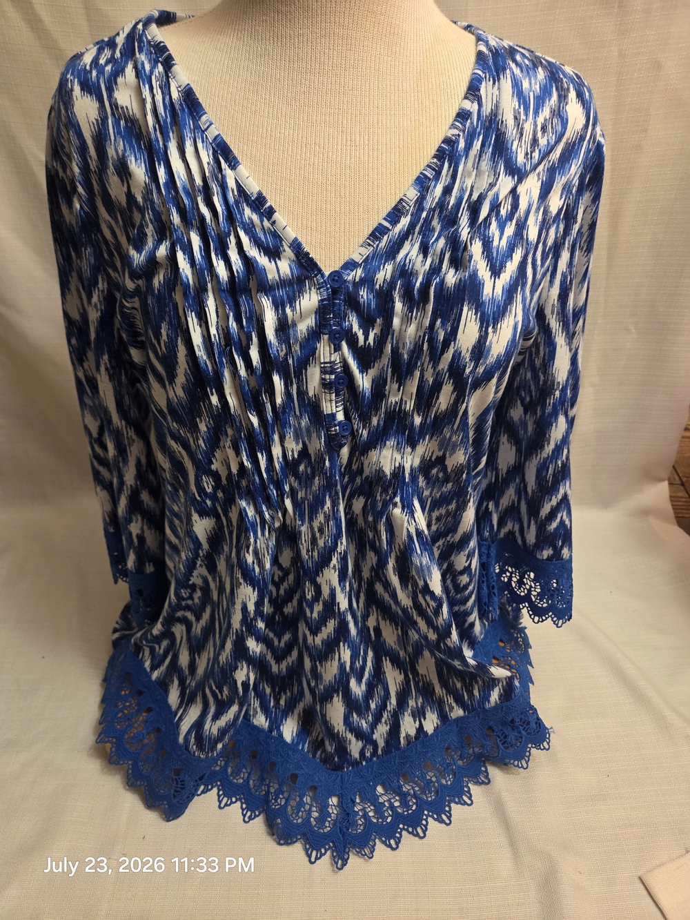 Absolutely Famous Blue and White Printed V‑Neck Top with Lace Trim